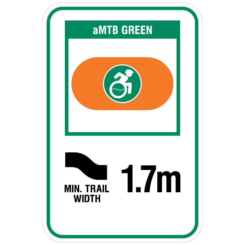 aMTB Green - Beginner features and moderate terrain. Signage for adaptive mountain biking freeride trails shows trail designation surrounded by an orange pill. The aMTB symbol indicates accessibility for adaptive bikes/riders on adaptive bike-friendly aMTB trails on trail networks.. Click to expand image