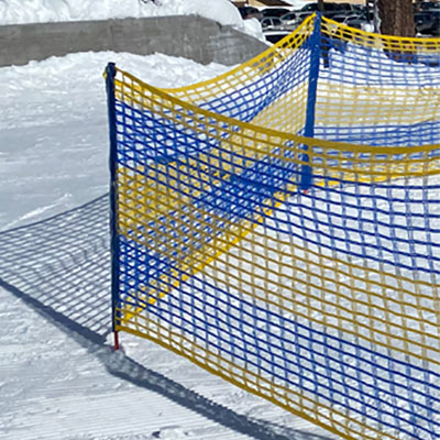 Barrier Fence - Yellow Blue on snow. Click to expand image