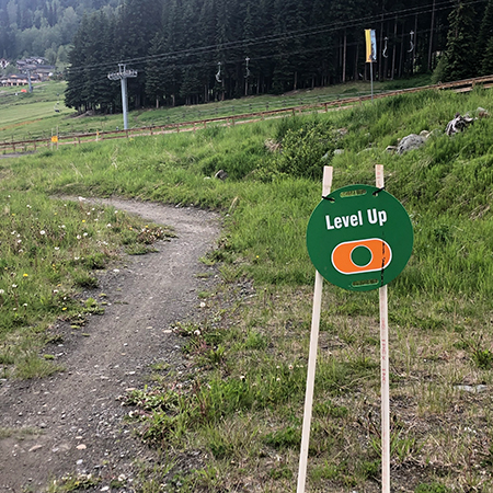 E150, 11.5 x 11.5, Freeride trail name, green circle polythylene disc, UV protected and cost effective marking signs, holes on top to hang from rope, slots top and bottom to fit over bamboo poles, trail and ability markers.. Click to expand image
