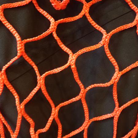 A close-up look at the weave of Inter-Mtn.'s ski area fencing Pop Fence in Orange. Click to expand image