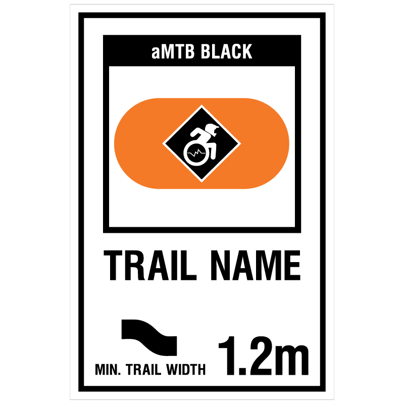 aMTB Black - Advanced obstacles exist, some trail obstructions. Signage for adaptive mountain biking freeride trails shows trail designation surrounded by an orange pill. The aMTB symbol indicates accessibility for adaptive bikes/riders on adaptive bike-friendly aMTB trails on trail networks.