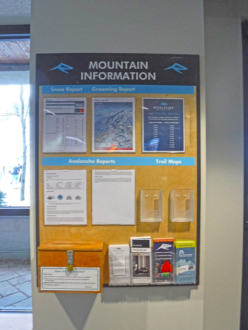 Revelstoke Information board with document holders, rack cards, and labels. Click to expand image