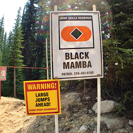 B312, 18 x 18, 12 x 12, warning large jumps ahead, gauge speed accordingly, Mountain bike risk and liability, safety, summer, trail, downhill, available on white or yellow coroplast and 12 gauge sign grade aluminum sheeted with top quality, high performance print* or vinyl graphics.. Click to expand image