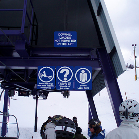Z01 If Unfamiliar With Use of Lift Ask Attendant For Instructions, Z11 Secure Loose Items, Z18 Downhill Loading Not Permitted On This Lift. Blue reflective aluminum CSA - Z98 sign with rounded corners - ski area sign - Inter-Mtn.. Click to expand image
