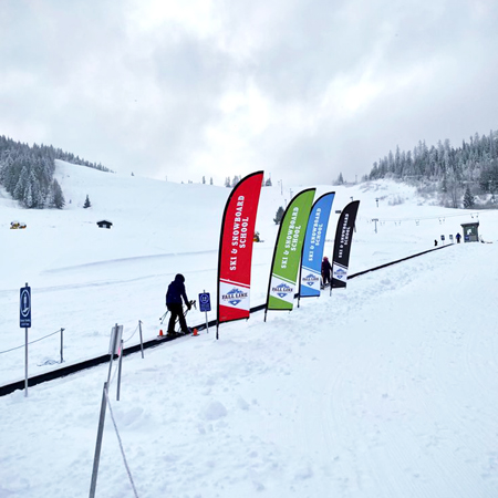 Wing banners are highly visible and portable instant advertising. Used for special events, ski races, kid centres, ski school, village accents, meeting places, mountain bike competitions, hotel entrances, golf courses, and tradeshows. Made by Inter-Mtn. Enterprises.. Click to expand image