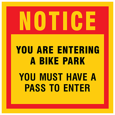 Notice, you are entering a bike park. You must have a pass to enter. Sign in red and yellow