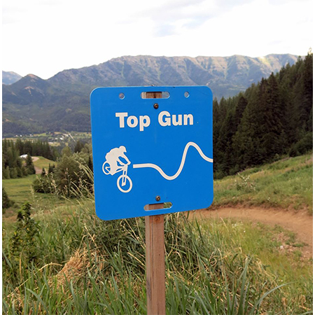 E101, 11.5 x 11.5, mountain bike trail name cross-country, blue square polythylene disc, UV protected and cost effective marking signs, holes on top to hang from rope, slots top and bottom to fit over bamboo poles, trail and ability markers.. Click to expand image