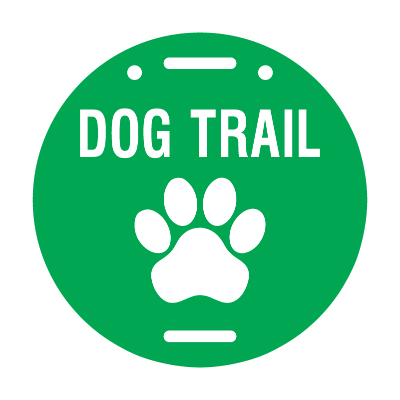 Green Circle Trail Marker with Dog Trail written in a white text and a Paw symbol on it to indicate that this beginner trail sign is dog friendly