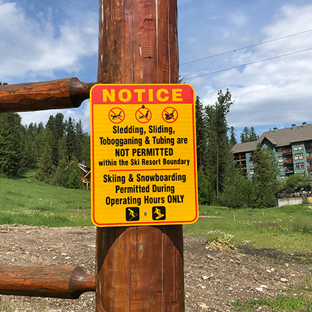 H608 18" x 24" Notice Sledding, Sliding, Tobogganing & Tubing NOT PERMITTED Skiing & Snowboard, yellow reflective aluminum closure sign with rounded corners - ski area sign - Inter-Mtn.. Click to expand image