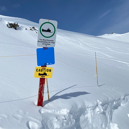 D03 Caution Snowmobile - 11.5" x 7" Yellow rectangle polythylene disc, UV protected and cost effective marking signs, holes on top to hang from rope, slots top and bottom to fit over bamboo poles, trail and ability markers.. Click to expand image
