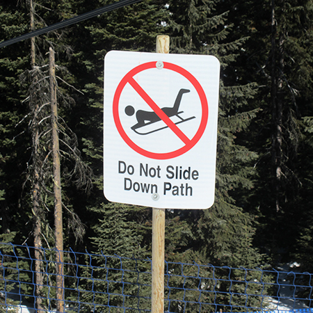 H117 No Tobogganing, Tubing or Sliding 18" x 24" White Reflective Aluminum Sign produced by Inter-Mtn.. Click to expand image