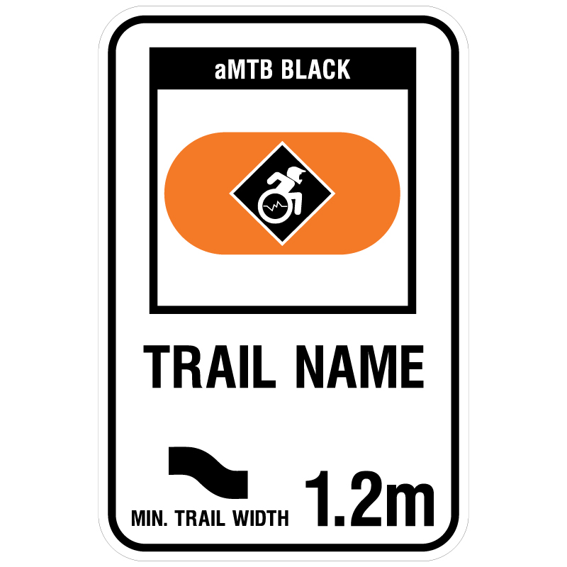 aMTB Black - Advanced obstacles exist, some trail obstructions. Signage for adaptive mountain biking freeride trails shows trail designation surrounded by an orange pill. The aMTB symbol indicates accessibility for adaptive bikes/riders on adaptive bike-friendly aMTB trails on trail networks.. Click to expand image