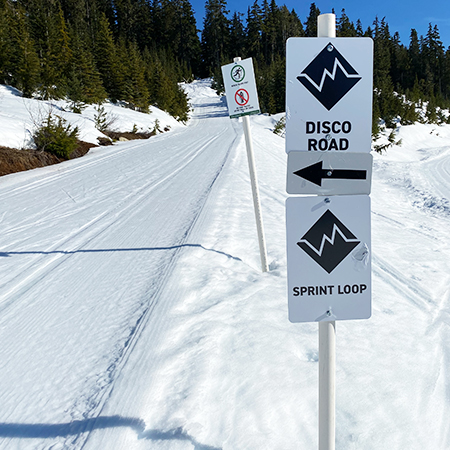 W154 Black Nordic with Custom Trail Name 18" x 24", white reflective aluminum nordic sign with rounded corners - ski area sign - Inter-Mtn.. Click to expand image