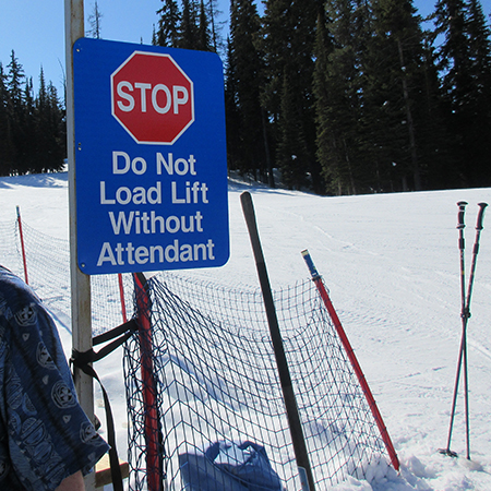L214 Stop Do Not Load Lift Without Attendant 18" x 24" Blue Reflective Aluminum lift sign for ski areas - produced by Inter-Mtn.. Click to expand image