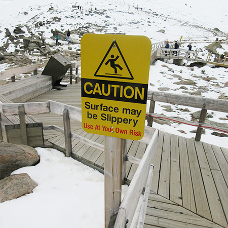 H127 CAUTION Ice Surface Slippery use at your own risk 18" x 24" Yellow Reflective Aluminum Sign produced by Inter-Mtn.. Click to expand image