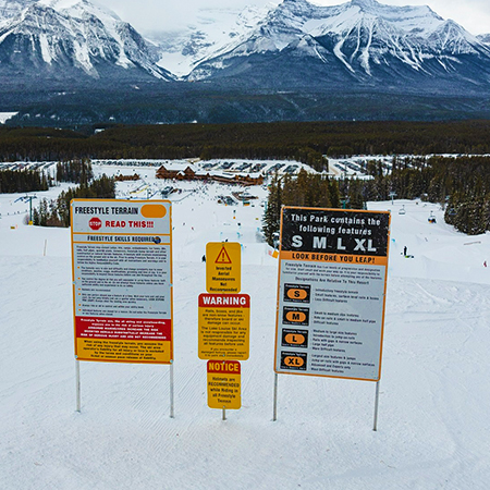T01 T05 36" x 58" Freestyle Terrain - Stop Read This Canadian Version, This Parks Features S M L XL, white reflective aluminum terrain park sign with rounded corners - ski area sign - Inter-Mtn.. Click to expand image