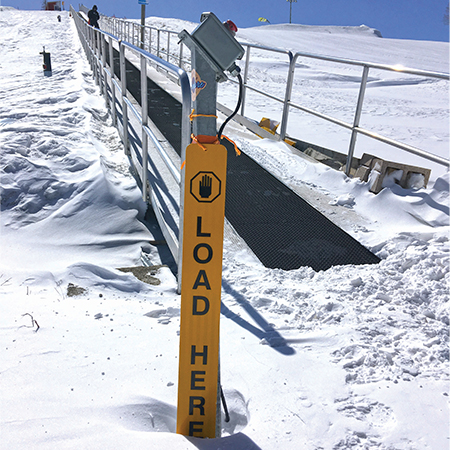 A07 Load Here - Vertical 4" x 18" Yellow Reflective Aluminum ANSI lift line sign for ski areas produced by Inter-Mtn.. Click to expand image