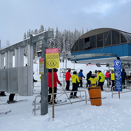 H606 18" x 24" Notice to Skiers, Snowboarders & Lift Passengers, Please Read Carefully, yellow reflective aluminum closure sign with rounded corners - ski area sign - Inter-Mtn.. Click to expand image