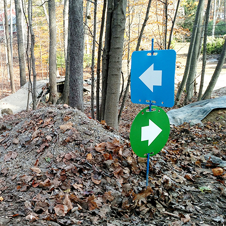 E112, 11.5 x 11.5, right arrow, green circle polythylene disc, UV protected and cost effective marking signs, holes on top to hang from rope, slots top and bottom to fit over bamboo poles, trail and ability markers.. Click to expand image