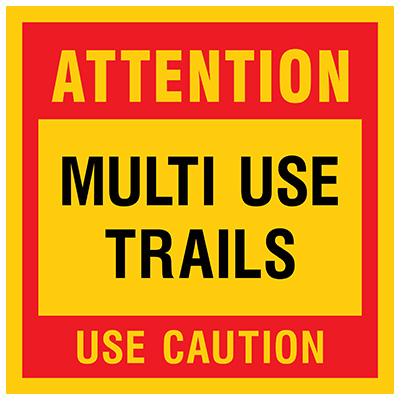 Attention, Multi-Use Trails. Use Caution sign for Mountain Bike Risk and Liability Signs in red and yellow