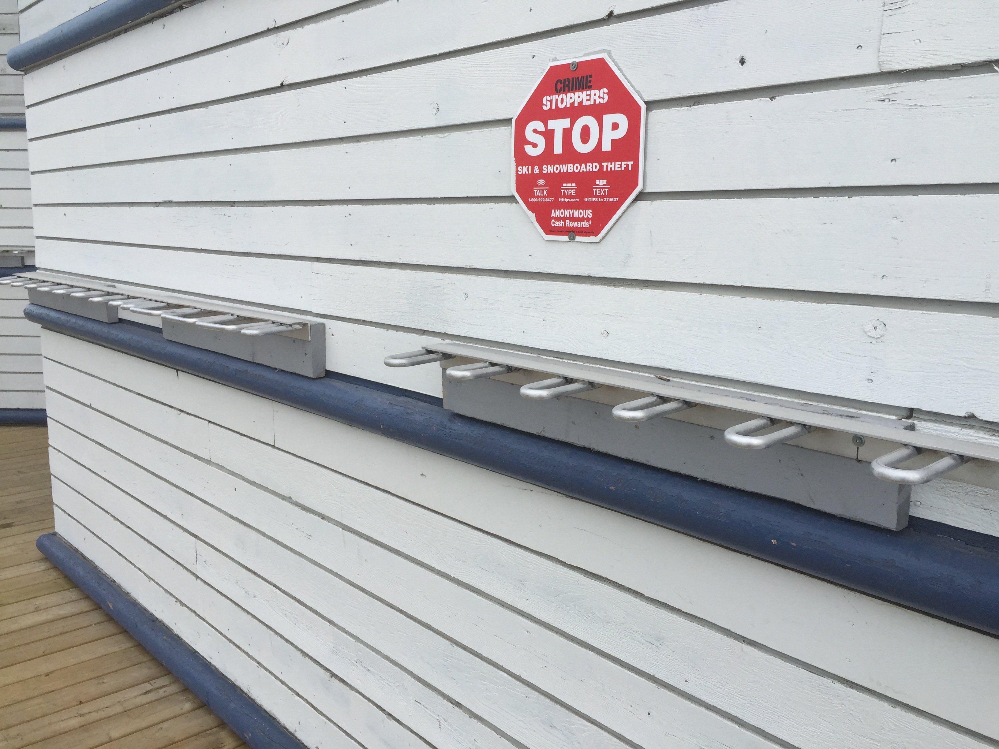 Aluminum wall-mounted ski racks for interior or exterior use at ski areas. Click to expand image