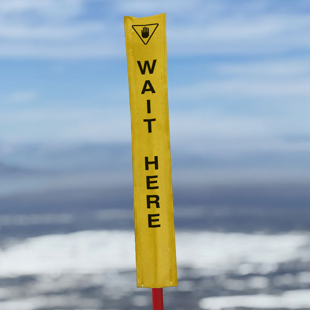 18oz vinyl banner material with a digital print - Pole Banner for ski resorts that reads wait here. Click to expand image