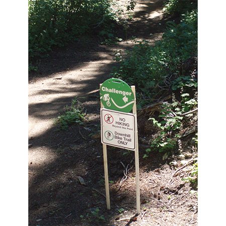 E100, 11.5 x 11.5, mountain bike trail name cross-country, green circle polythylene disc, UV protected and cost effective marking signs, holes on top to hang from rope, slots top and bottom to fit over bamboo poles, trail and ability markers.. Click to expand image